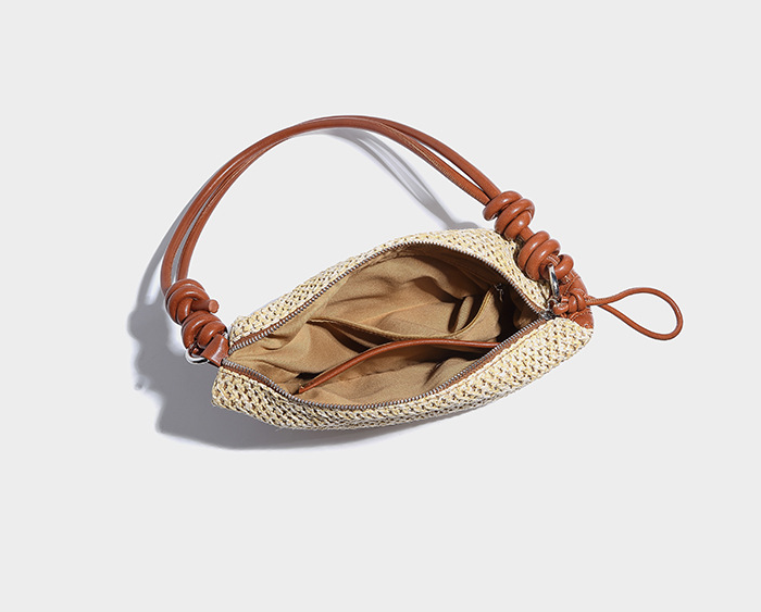 Small niche design, hand woven dumpling buns New vacation style grass woven bag Commuter Crescent Cross Bag