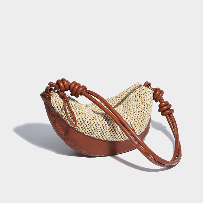 Small niche design, hand woven dumpling buns New vacation style grass woven bag Commuter Crescent Cross Bag